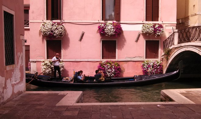 Gondolier with cell phone.