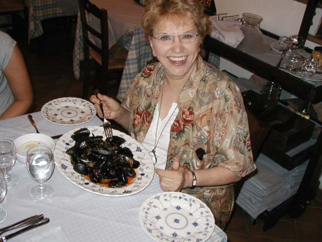 My mom, Win Perman, enjoying some steamed mussels in Sorrento ten years ago.
